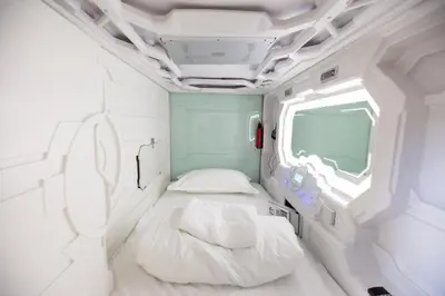 Ein Bett oder Betten in einem Zimmer der Unterkunft Spacehotel Karlsruhe