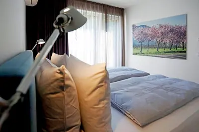Ein Bett oder Betten in einem Zimmer der Unterkunft Maximilians Domizil Edenkoben