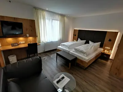 Ein Bett oder Betten in einem Zimmer der Unterkunft Gästehaus Dorflinde