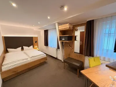 Ein Bett oder Betten in einem Zimmer der Unterkunft Gästehaus Dorflinde