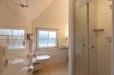 Ein Badezimmer in der Unterkunft Gasper Business & Garden Hotel