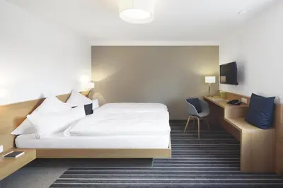 Ein Bett oder Betten in einem Zimmer der Unterkunft Hotel Hiller in Abstatt