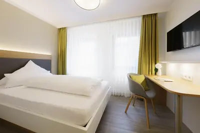 Ein Bett oder Betten in einem Zimmer der Unterkunft Hotel Hiller in Abstatt