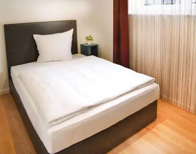 Ein Bett oder Betten in einem Zimmer der Unterkunft SEEGER Living Premium West