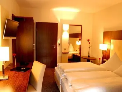 Ein Bett oder Betten in einem Zimmer der Unterkunft Hotel Sterkel