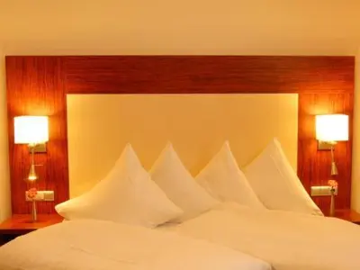 Ein Bett oder Betten in einem Zimmer der Unterkunft Hotel Sterkel