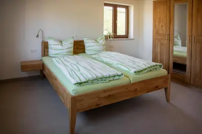 Ein Bett oder Betten in einem Zimmer der Unterkunft Ferienwohnungen Thoma