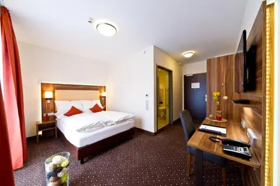 Ein Bett oder Betten in einem Zimmer der Unterkunft Wohlfühl-Hotel Neu Heidelberg