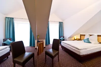 Ein Bett oder Betten in einem Zimmer der Unterkunft Wohlfühl-Hotel Neu Heidelberg