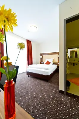Ein Bett oder Betten in einem Zimmer der Unterkunft Wohlfühl-Hotel Neu Heidelberg
