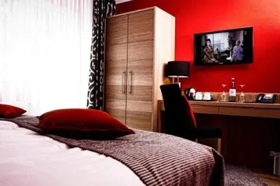 Ein Bett oder Betten in einem Zimmer der Unterkunft Hotel Palatina 