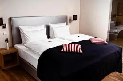 Ein Bett oder Betten in einem Zimmer der Unterkunft Hotel Palatina 