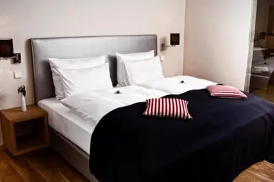 Ein Bett oder Betten in einem Zimmer der Unterkunft Hotel Palatina 