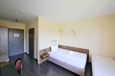 Ein Bett oder Betten in einem Zimmer der Unterkunft Hotel Kick