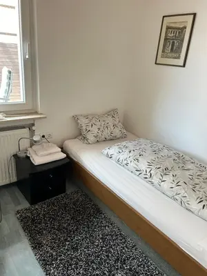 Ein Bett oder Betten in einem Zimmer der Unterkunft Apartment am Rathaus 3SZ