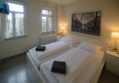 Ein Bett oder Betten in einem Zimmer der Unterkunft Hotel Krone Zentrum