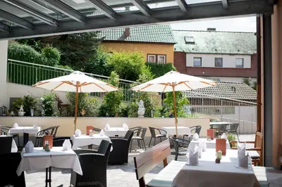Ein Restaurant oder anderes Speiselokal in der Unterkunft Hotel Rose