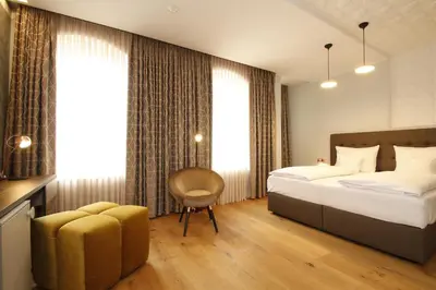 Ein Bett oder Betten in einem Zimmer der Unterkunft Amelie No 1 Hotel & Appartements