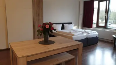 Ein Bett oder Betten in einem Zimmer der Unterkunft Apart-Hotel-Kick