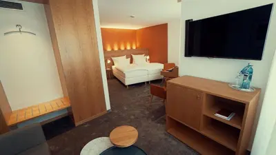 Ein Bett oder Betten in einem Zimmer der Unterkunft Hotel Adler Asperg