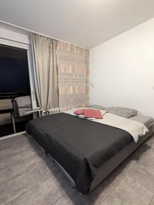 Ein Bett oder Betten in einem Zimmer der Unterkunft Apartment Kornwestheim