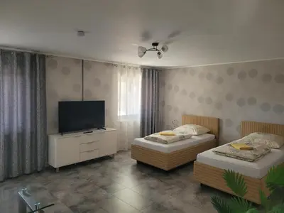 Ein Bett oder Betten in einem Zimmer der Unterkunft Ferienwohnung Wolfsberg