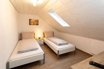 Ein Bett oder Betten in einem Zimmer der Unterkunft Gästezimmer - Ferienwohnung 2 - Brauhaus Dürr