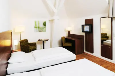 Ein Bett oder Betten in einem Zimmer der Unterkunft Bildungshaus St. Bernhard - Wohnen und Tagen