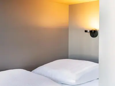 Ein Bett oder Betten in einem Zimmer der Unterkunft B&B Hotel Mainz-Hechtsheim