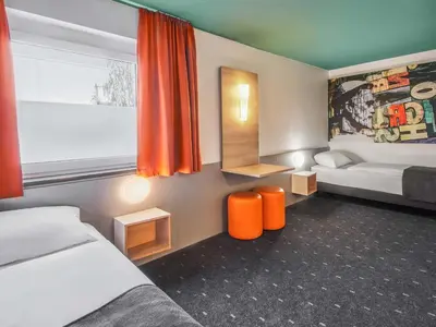 Ein Bett oder Betten in einem Zimmer der Unterkunft B&B Hotel Mainz-Hechtsheim