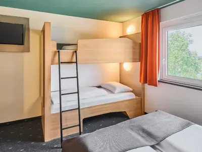 Ein Bett oder Betten in einem Zimmer der Unterkunft B&B Hotel Mainz-Hechtsheim
