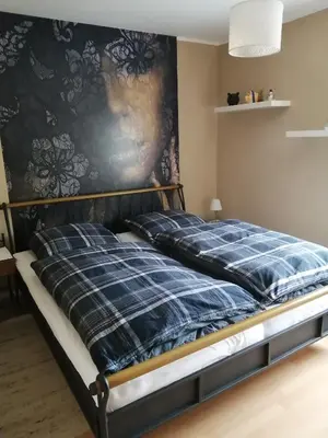 Ein Bett oder Betten in einem Zimmer der Unterkunft Ferienwohnung Wörrstadt