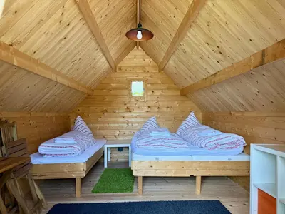 Ein Bett oder Betten in einem Zimmer der Unterkunft Kastanienhof Apartment Hotel