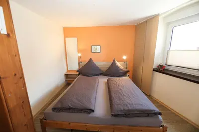 Ein Bett oder Betten in einem Zimmer der Unterkunft Gästehaus Villa Wernz