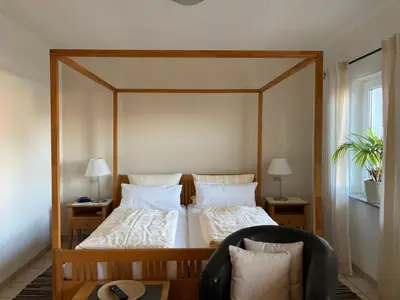 Ein Bett oder Betten in einem Zimmer der Unterkunft Landhaus-Apartments