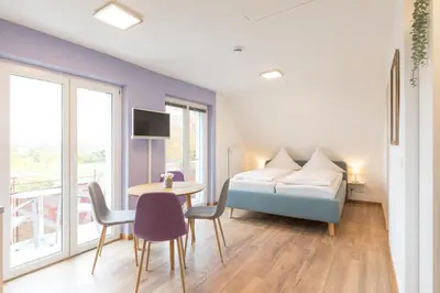 Ein Bett oder Betten in einem Zimmer der Unterkunft Schäfer's Ferienhof Michaelsberg