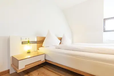 Ein Bett oder Betten in einem Zimmer der Unterkunft Schäfer's Ferienhof Michaelsberg