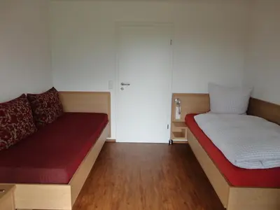 Ein Bett oder Betten in einem Zimmer der Unterkunft Ferienwohnung 4 in den Krautgärten