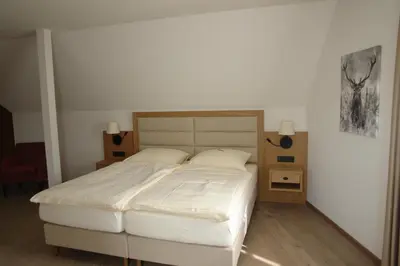 Ein Bett oder Betten in einem Zimmer der Unterkunft Hotel Kallstadter Hof