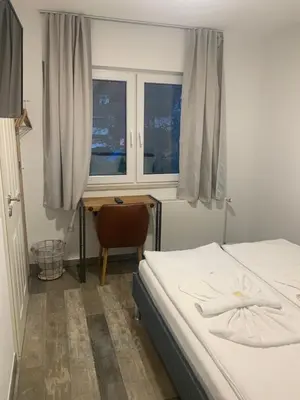 Ein Bett oder Betten in einem Zimmer der Unterkunft Grüner Baum