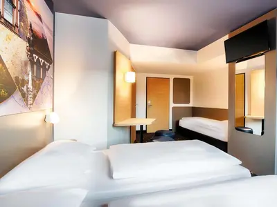 Ein Bett oder Betten in einem Zimmer der Unterkunft B&B Hotel Kaiserslautern