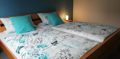 Ein Bett oder Betten in einem Zimmer der Unterkunft Annettes Ferienwohnung