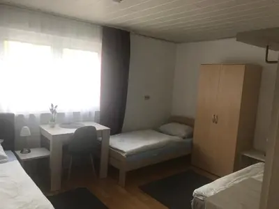 Ein Bett oder Betten in einem Zimmer der Unterkunft JUNA
