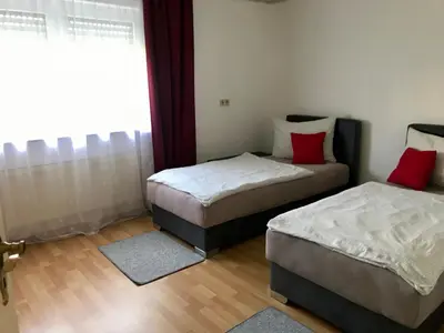Ein Bett oder Betten in einem Zimmer der Unterkunft JUNA