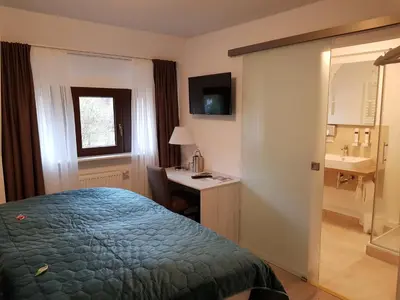Ein Bett oder Betten in einem Zimmer der Unterkunft Oberwaldhaus