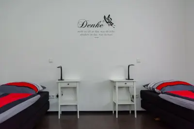 Ein Bett oder Betten in einem Zimmer der Unterkunft Zimmervermietung Dietzenbach