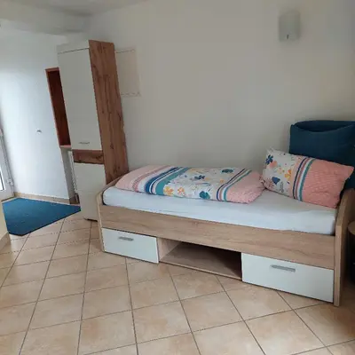 Ein Bett oder Betten in einem Zimmer der Unterkunft Ottilienhof
