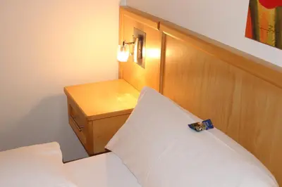 Ein Bett oder Betten in einem Zimmer der Unterkunft Gästehaus Kirschgarten