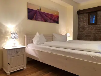 Ein Bett oder Betten in einem Zimmer der Unterkunft Hotel Weingärtner