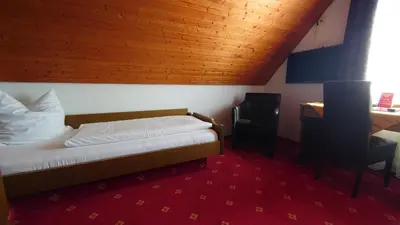 Ein Bett oder Betten in einem Zimmer der Unterkunft Hotel Landgasthof Fromm